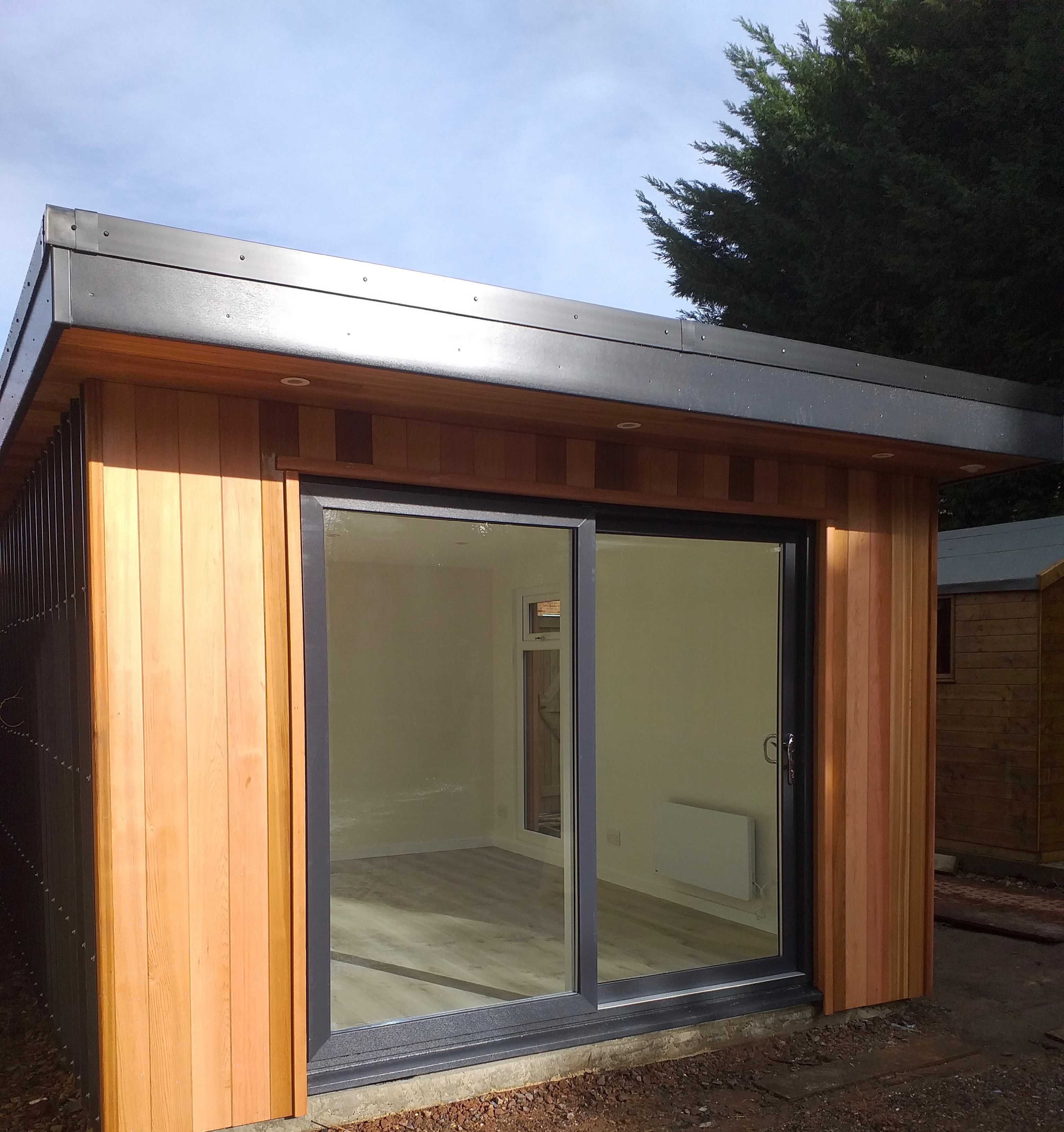 Cedar garden room with sliding door